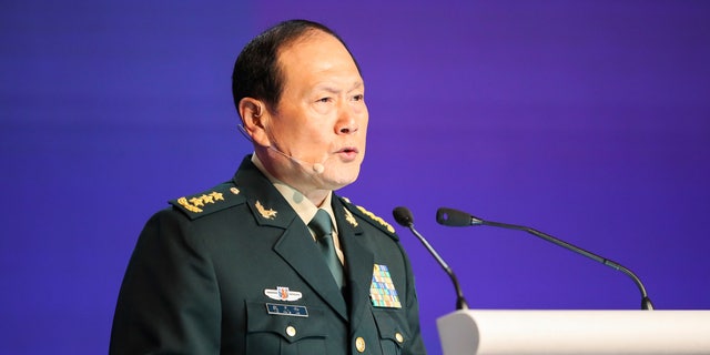 China's Defense Minister General Wei Fenghe speaks at a plenary session during the 19th International Institute for Strategic Studies Shangri-la Dialogue, Asia's annual defense and security forum, in Singapore, Sunday, June 12, 2022. 