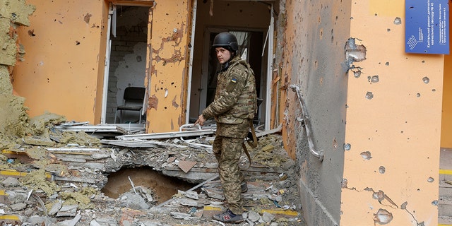 A Ukrainian service member shows a kindergarten damaged by a military strike, as Russia's attack on Ukraine continues, in Sievierodonetsk, Luhansk region, Ukraine April 16, 2022.
