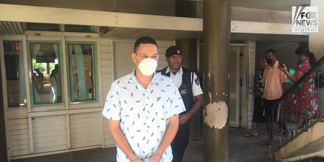 Bradley Dawson arrives to Fiji court for his bail hearing.