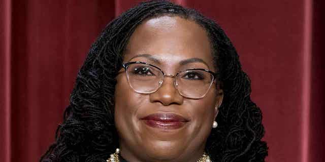 Associate Justice Ketanji Brown Jackson stands as she poses for a new group portrait following her addition to the Supreme Court, in Washington, on Oct. 7, 2022. Jackson issued her first Supreme Court opinion on Monday.