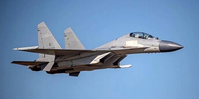 In this undated file photo released by the Taiwan Ministry of Defense, a Chinese PLA J-16 fighter jet flies in an undisclosed location. China’s military sent 71 planes, including J16 fighter jets, and seven ships toward Taiwan in a 24-hour display of force directed at the island, Taiwan’s defense ministry said Monday, Dec. 26, 2022, after China expressed anger at Taiwan-related provisions in a U.S. annual defense spending bill passed on Saturday.